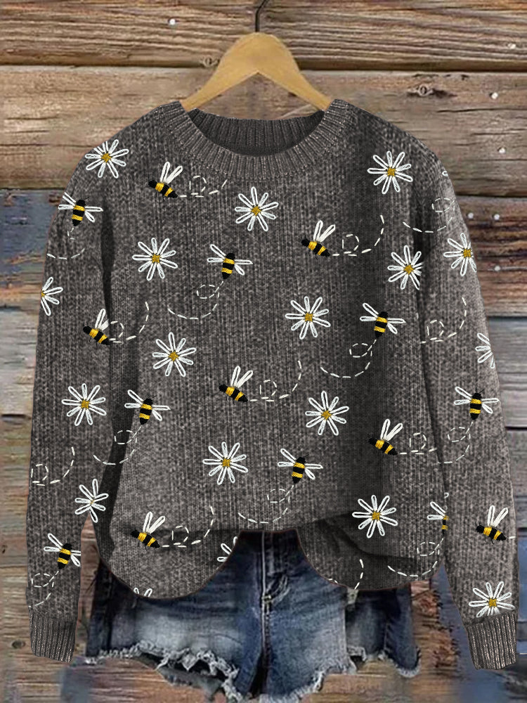 Strickpullover mit Gänseblümchen- und Bienenstickerei