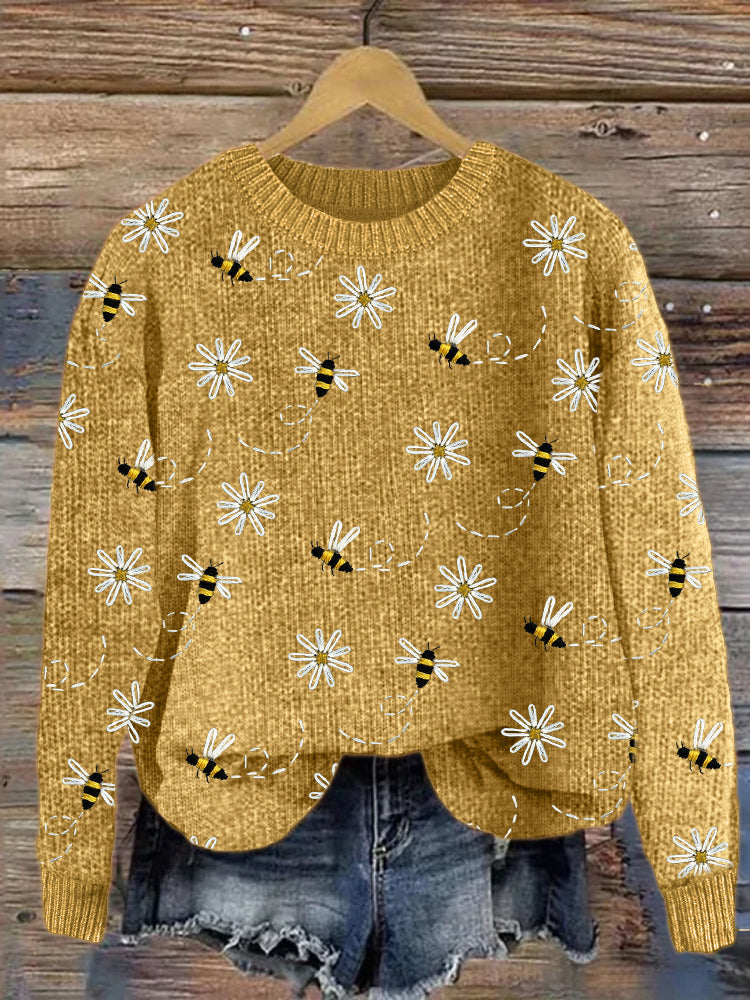 Strickpullover mit Gänseblümchen- und Bienenstickerei