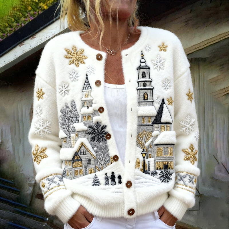 Fleece-Strickjacke mit verschneiter Winterdorf-Architektur